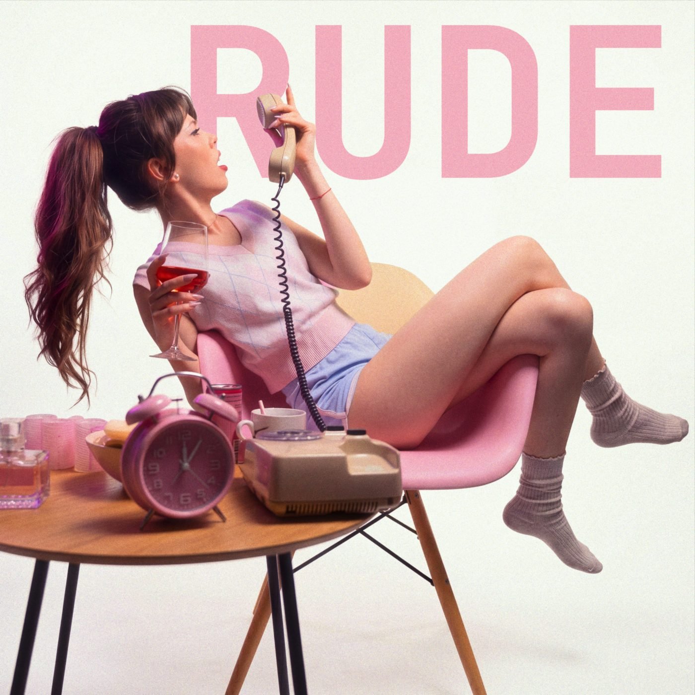 RUDE — Franci on a pink chair with a landline phone